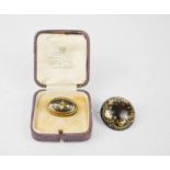 Two 19th century tortoiseshell brooches, inlaid with silver and gold; one of oval form with floral