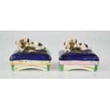 A pair of 19th century Staffordshire type pen holders, modelled with two spaniels on cobalt blue