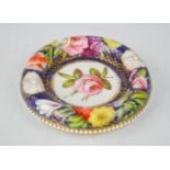 A 19th century Spode coaster, painted with flowers, marked in puce Spode 1166 to the base, 10cm