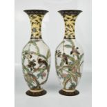 A pair of 19th century Chinese cloisonne enamelled vases depicting birds on a white ground, 33cm