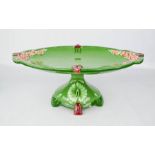 An Eichwald Art Nouveau oval comport, in green and modelled with pink roses, 14cm high.