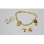 A 9ct gold childs charm bracelet and three charms, a pair of 9ct gold earrings, 8.4g.