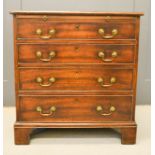 A Georgian mahogany bachelors chest, with brush slide above four long graduated drawers, raised on