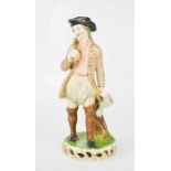 An early 19th century German porcelain vagabond, possibly Dresden, 22cm high.