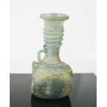 Antiquities: a 4th century Roman iridescent perfume bottle, 15cm high.