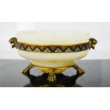 A 19th century marble and ormolu bowl, with enamelled border and protruding lynx heads, raised on