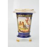 A 19th century porcelain vase, with a hand painted scene depicting a castle, cobalt blue ground,