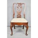 An 18th century chair, circa 1720 with drop in upholstered seat.