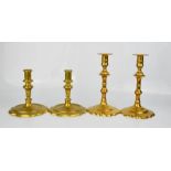 Two pairs of 19th century candlesticks, one with scalloped candle sockets and bases; 20cm high.