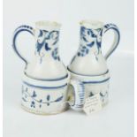 An 18th century French faience oil and vinegar. 14cms high, 15cms long