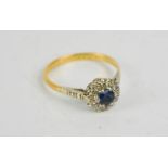 An 18ct gold flowerhead ring, sapphire centre, M/N, 2.7g.