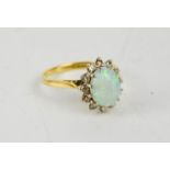 An 18ct gold yellow and white gold mounted opal and diamond cluster ring, with oval cabochon opal