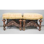A rare and fine pair of late 17th century walnut stools, with silk upholstered seats, carved legs