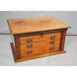 A 19th century canteen of cutlery, the mahogany case having three drawers enclosed by locking