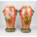 A pair of Minton vases, with ochre ground, hand painted with flowers. 41.5cms tall