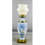 A Wedgwood blue Jasperware paraffin lamp with glass shade, 43cm high, 15cm wide.