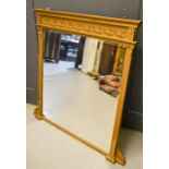 A 19th century giltwood over mantle mirror, with frieze to the top modelled with flowers and