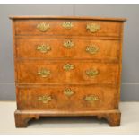 An 18th century walnut veneered chest of drawers, four long graduated drawers, and raised on bracket