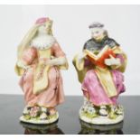 A rare pair of 18th century Italian glazed pottery figures; monk reading a breviary, the other a