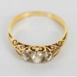 A yellow metal and old cut three stone diamond ring, Edwardian setting, 4g. Size between P and Q