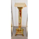 A 19th century onyx pedestal column, with gilt brass mounts and paw feet, 108cm high.