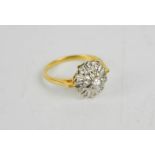 An 18ct gold starburst and diamond set ring, 3g.