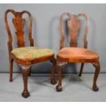 A pair of Queen Anne walnut side chairs, with shaped drop in seats, the cabriole legs carved with