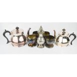 A group of silver plateware to include two tea pots, sugar sifter and other items.