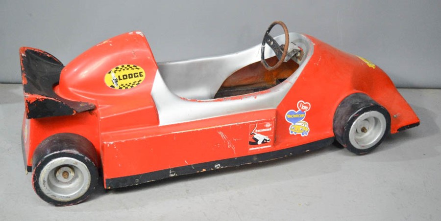 A fibreglass F1 racing car from a fair ground ride.