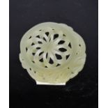 A Chinese Heitian jade carved chrysanthemum pendant.