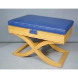A modern design beech luggage rack, with blue upholstered seat, opening to reveal aluminium