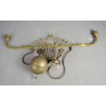 An Edwardian brass double pendant light fitting, with pulley and weight.