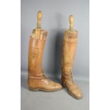A pair of gentlemans antique boot trees and leather riding boots by Tom Hill of London.