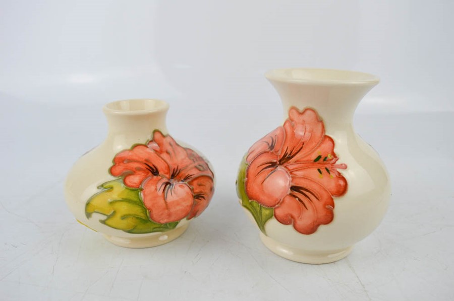 Two Moorcroft vases, both approximately 10cm high.