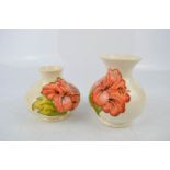 Two Moorcroft vases, both approximately 10cm high.