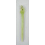 A Chinese Heitian pale green jade hair pin, carved with a phoenix.