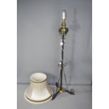 An antique oil lamp, converted to a lamp standard.