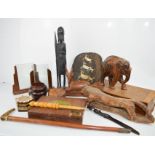 A selection of treen, to include letter openers, carved tribal figure, photo frame etc.