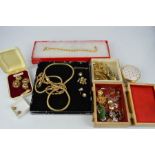 A quantity of costume jewellery, earrings, necklaces and other items.