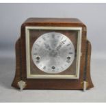 A 1930s square form mantle clock with roman numeral dial.