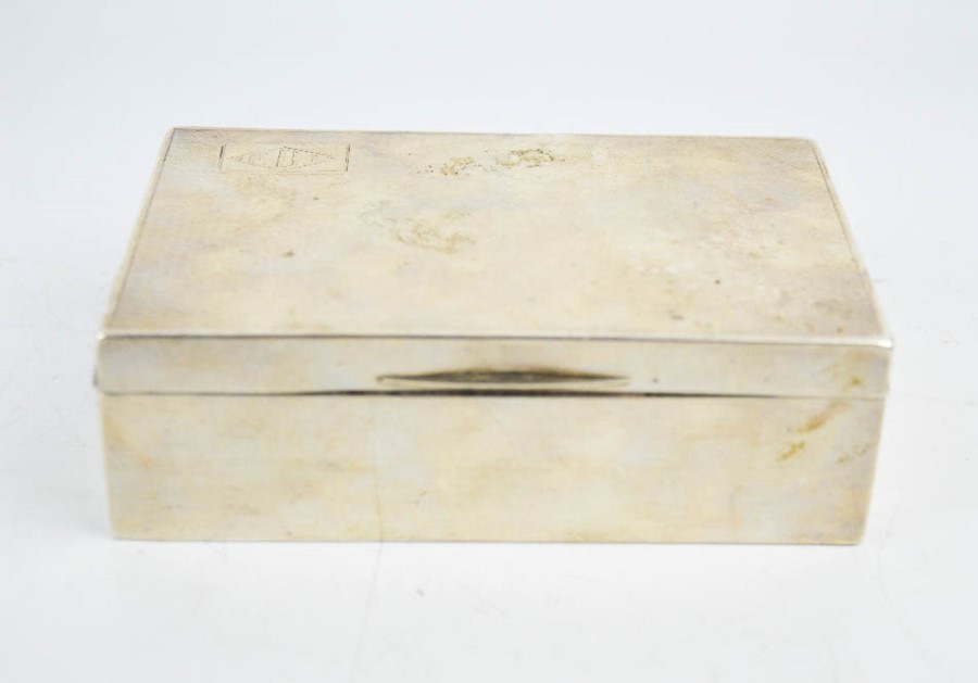 A silver cigarette box, machine engraved with decoration, indistinct worn hallmarks. 266g total