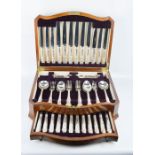 A canteen of viners cutlery, mahogany velvet lined case.