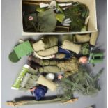 An Action Man, together with accessories, including satchels, sleeping bags, rifles, tent, stretcher