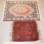Two prayer rugs.