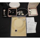 A group of jewellery and watches to include silver earrings and necklace set, Fossil bracelet, Seksy