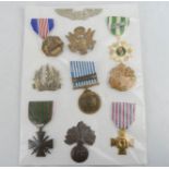 A group of ten military world medals and badges, including USA, French, UN and Israel.