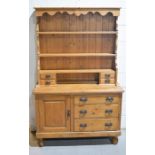 An Edwardian pine dresser and rack, 186 by 43 by 117cm.