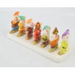 The Seven Dwarfs ceramic toast rack. [Being sold for charitable causes by Bargain Hunt, Market