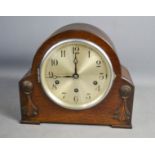 A 1930s mantle clock with arabic dial.