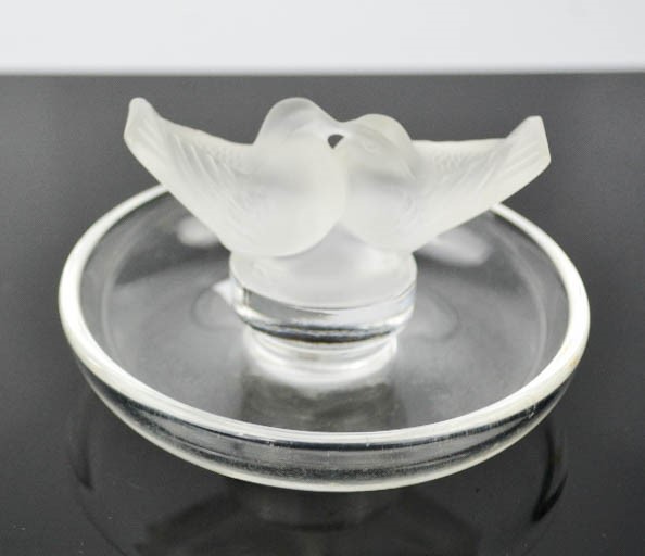 A Lalique glass dish, modelled with love birds, signed to the base, Lalique, France, 10cm diameter.